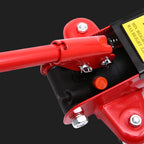 Close-up of a red mechanical component with visible bolts on a black background