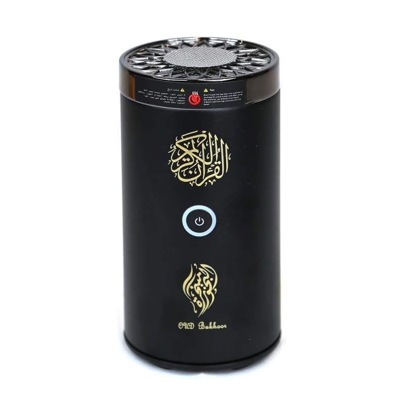 Black cylindrical device with gold designs and branding on a white background
